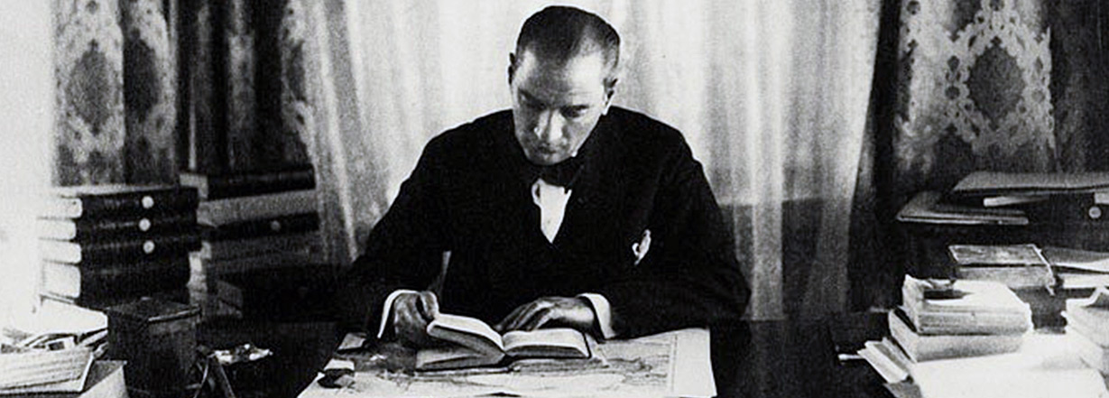 Mustafa Kemal Atatürk is reading a book.